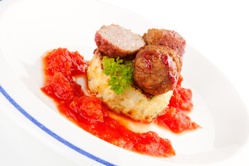 Meatballs, tomato sauce and mashed potatoes.