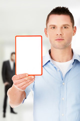 Happy man showing and displaying placard