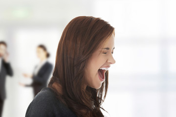 Frustrated and angry woman screaming.