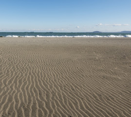 Fototapeta na wymiar Sand and sea waves.