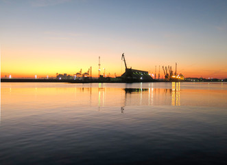 Fototapeta na wymiar Crane in the port of Bourgas at sunset