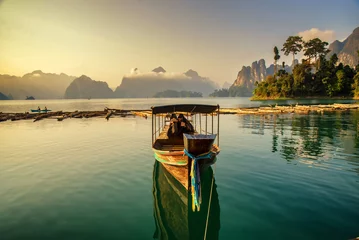 Fotobehang long tail boat park on a raft © martinhosmat083