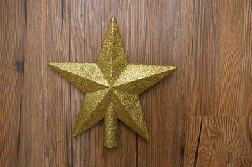 Fototapeta na wymiar Gold glitter star Christmas tree topper