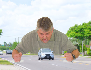Road rage with angry man slamming his fists down on the road around a car as he screams at the car...