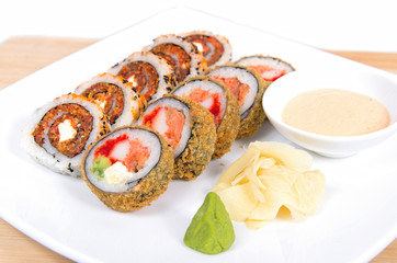 Assorted sushi dish on a white square dish