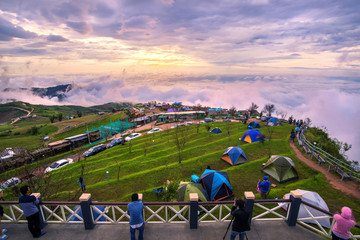 beautiful landscape view point of sea of clouds and tents on a h