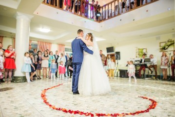 First wedding dance on heart of flowers