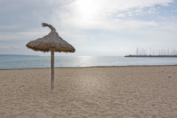Parasols on winter beach