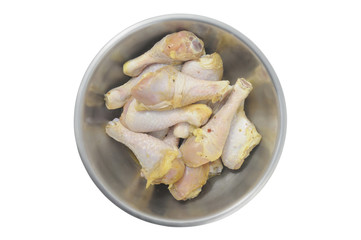 Chicken legs pickled in  bowl isolated on white