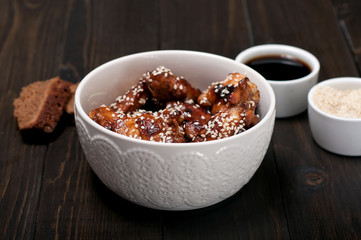 Chicken drumsticks in a sweet and sour sauce in Thai