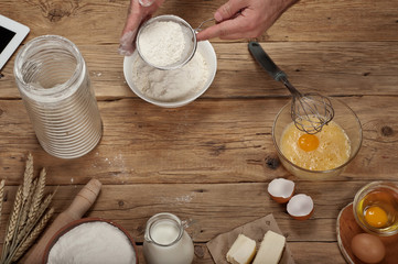 Male chef sifting flour