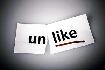 The word unlike changed to like on torn paper