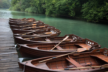 Boats mooring at pier