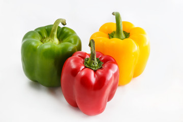 Fresh peppers. Three sweet Red, Yellow, Green Peppers isolated on white background.