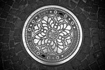 Decorative manhole cover from Budapest, Hungary. - 99209673
