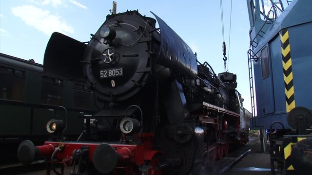 Loading a steam locomotive with coal. Locomotive 52 8053 (Henschel & Sohn, Kassel) from 1943, at Beekbergen railway station, The Netherlands.