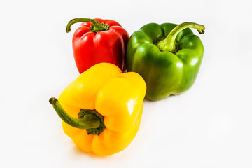Fresh peppers. Three sweet Red, Yellow, Green Peppers isolated on white background.