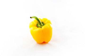 Fresh vegetable, yellow pepper on a white background.