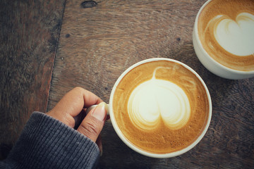 Two cups of latte art coffee