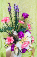 colorful flowers bouquet on green background