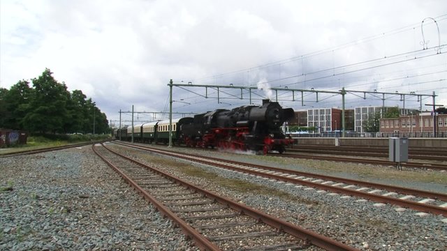 Steam train departure Apeldoorn railway station - on camera. Locomotive 52 8053 (Henschel & Sohn, Kassel) from 1943.