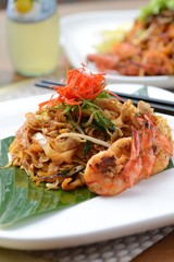 Stir fried penang char kway teow with orange juice