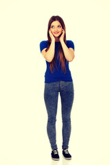 Happy thoughtful woman looking up.