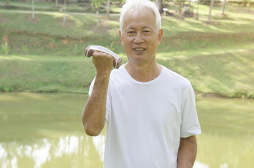 asian senior outdoor dumbell