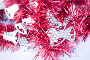 Red holiday decoration ribbon on white background