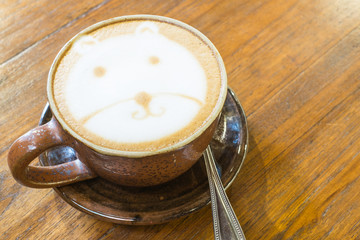 Hot Cappuccino on wooden background ,Cup of art coffee