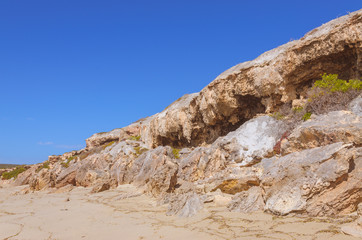 Fototapeta na wymiar Sunny day landscape coast line cliffs at the beach