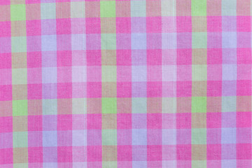 Pink classic checkered tablecloth texture, background with copy