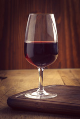 glasses and bottle of wine on old wood