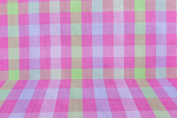 Pink classic checkered tablecloth texture, background with copy