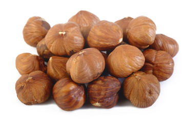 peeled hazelnuts isolated on white background