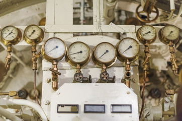 Detailed view of many manometers inside of submarine.