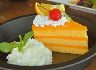 Orange cake  on wooden background