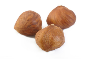 peeled hazelnuts isolated on white