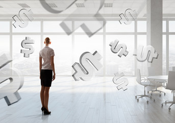 Businesswoman in top floor office