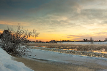 Sunset Over The Freezing River