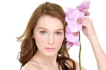 Woman with beautiful makeup and pink orchids