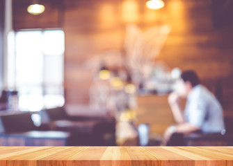 Empty wood table with blur coffee shop background,Mock up Templa