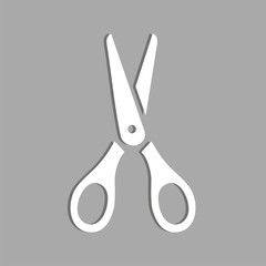 Icono de tijeras sobre un fondo gris