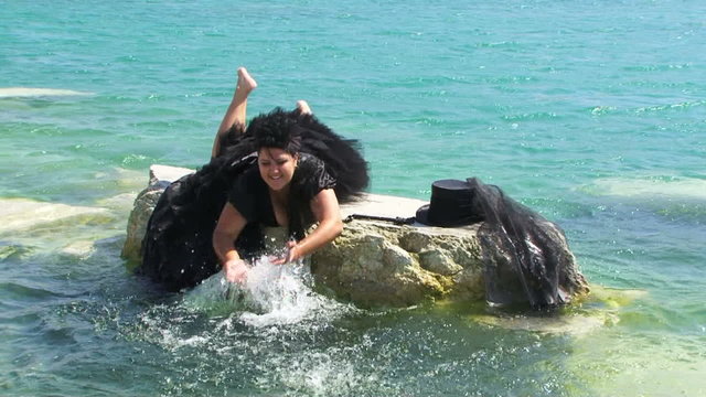Woman In Black Splashing Lake Water