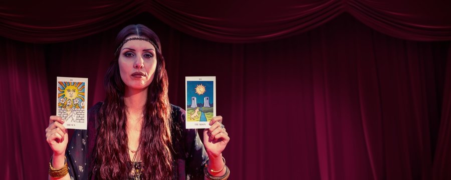 Composite image of portrait of serious fortune teller woman 