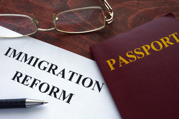 Paper with immigration reform on a table.