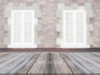 Wooden board empty table in front of blurred background. Perspective grey wood over blur ceramic tile brick wall in background - can be used for display or montage your products.