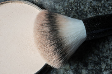 macro shot of a used make up brush on black background