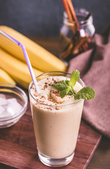 Banana smoothie on table