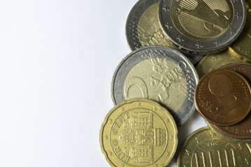 used euro coins with scratches on white background